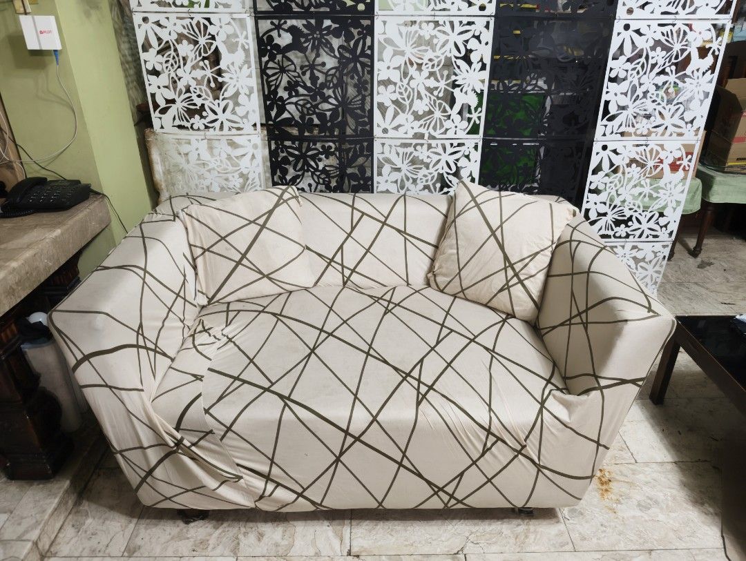 2-Seater Sofa / Couch with Cover and Pillows! (Category: Sofas) located in Quezon City. Submitted by franz14 (Listing ID 1439378774, Image 2). Description: Declutter #4 - 2-seater sofa with armrest! - Includes two matching throw pillows - Dark brown sofa (underneath cover) - Ideal for living rooms and seating areas only issue: nabutas na cover lang ng dog namin. and lost one foot, but can be fixed easily! 700 nalang! pamigay ko na..need lang tala