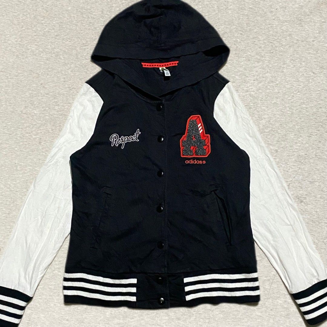 Adidas Varsity Jacket (Category: Coats, Jackets and Outerwear) located in Mabalacat. Submitted by stylists.market (Listing ID 1439418563, Image 1). Description: adidas varsity Length : 24 Width : 19 Condition : 9.5/10 SUPER SOLID NG LOGOS!! EMBROIDERED ALL LOGOS WITH 3 LINES SUPER SMOOTH SNAP BUTTONS complete tags SUPER NICE & KINIS! VERY COMFY & SMOOTH ON SKIN check last photo may chip lang sa color ng isang button NEED WASH SA WHITE PART SLEEVE