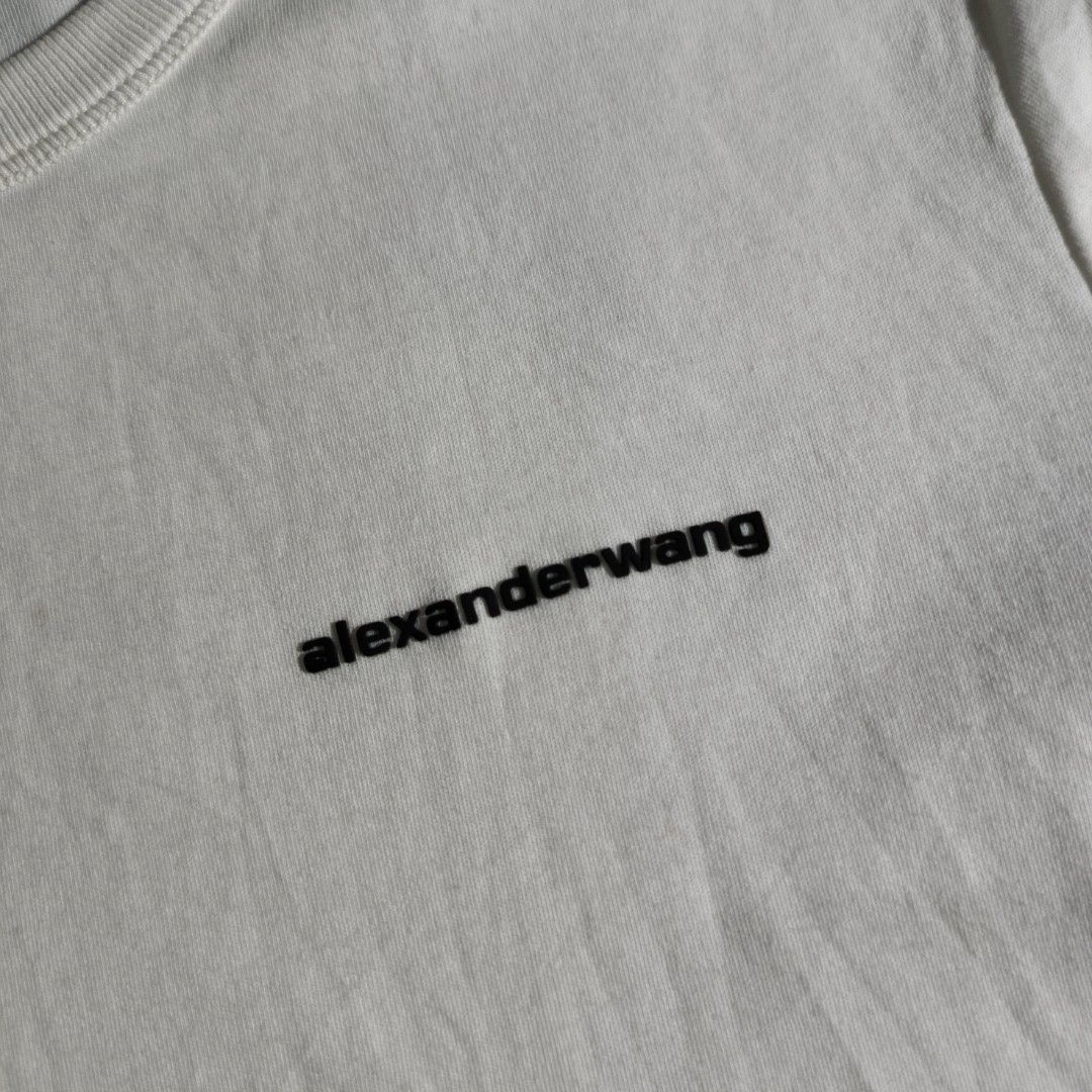 Alexander Wang Basic Logo Short-Sleeve T-shirt (Category: Luxury Apparel) located in Antipolo. Submitted by soon2byours_ (Listing ID 1439378151, Image 3). Description: Dimensions (laid flat): Pit to Pit: 18" Length: 21" [Medium on tag] Flaws: minor stains Color Rate: 10/10 (white) Condition: EXCELLENT COLOR MAY VARY DUE TO LIGHTING!.