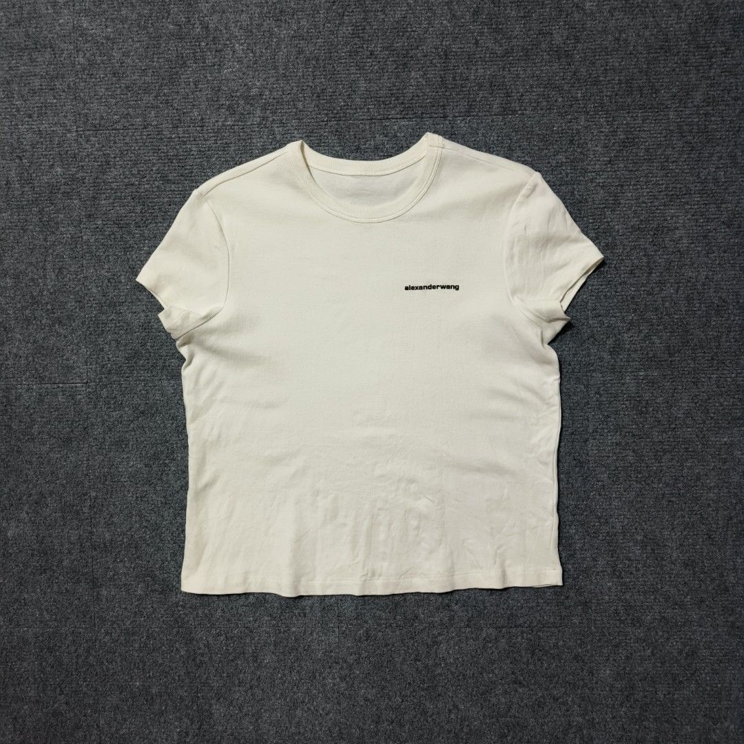 Alexander Wang Basic Logo Short-Sleeve T-shirt (Category: Luxury Apparel) located in Antipolo. Submitted by soon2byours_ (Listing ID 1439378151, Image 1). Description: Dimensions (laid flat): Pit to Pit: 18" Length: 21" [Medium on tag] Flaws: minor stains Color Rate: 10/10 (white) Condition: EXCELLENT COLOR MAY VARY DUE TO LIGHTING!.