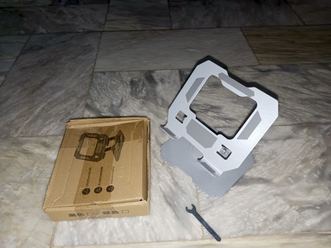 Aluminum Tablet Stand (Category: Laptop Bags & Sleeves) located in Rizal. Submitted by kazuya.kazuya (Listing ID 1439291648, Image 2). Description: - Aluminum laptop stand - Designed for stability and ergonomic use - Sturdy build and sleek design - Comes with original box and wrench.