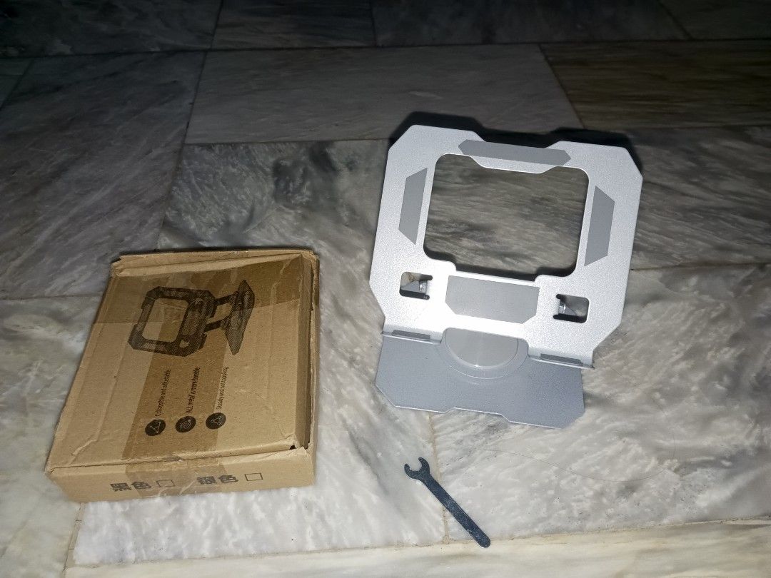 Aluminum Tablet Stand (Category: Laptop Bags & Sleeves) located in Rizal. Submitted by kazuya.kazuya (Listing ID 1439291648, Image 1). Description: - Aluminum laptop stand - Designed for stability and ergonomic use - Sturdy build and sleek design - Comes with original box and wrench.