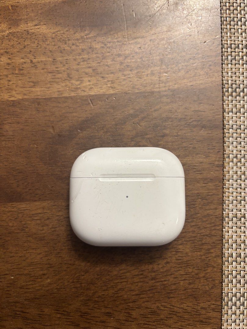 Apple AirPods 3rd Generation (Category: Earphones) located in Manila. Submitted by maxybrandy (Listing ID 1439259093, Image 2). Description: - Apple AirPods 3rd Generation with charging case - Charging case has a green light indicator - Case has visible marks and scratches - Earbuds have some wear and tear - Right earbuds sometimes charges but the problem is with the case. .