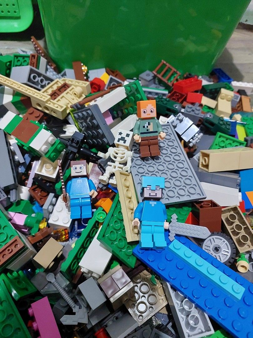 Assorted Lego Bricks with Storage Bin (Category: Lego & Building Sets) located in Quezon City. Submitted by jpnvintageonline (Listing ID 1439287835, Image 3). Description: - Large collection of assorted Lego bricks - Includes green baseplates and Minecraft figures - Comes with a green storage bin - Features various colors and sizes of bricks - Contains specialized Lego pieces - Ideal for building and creative play -almost 2kilos.