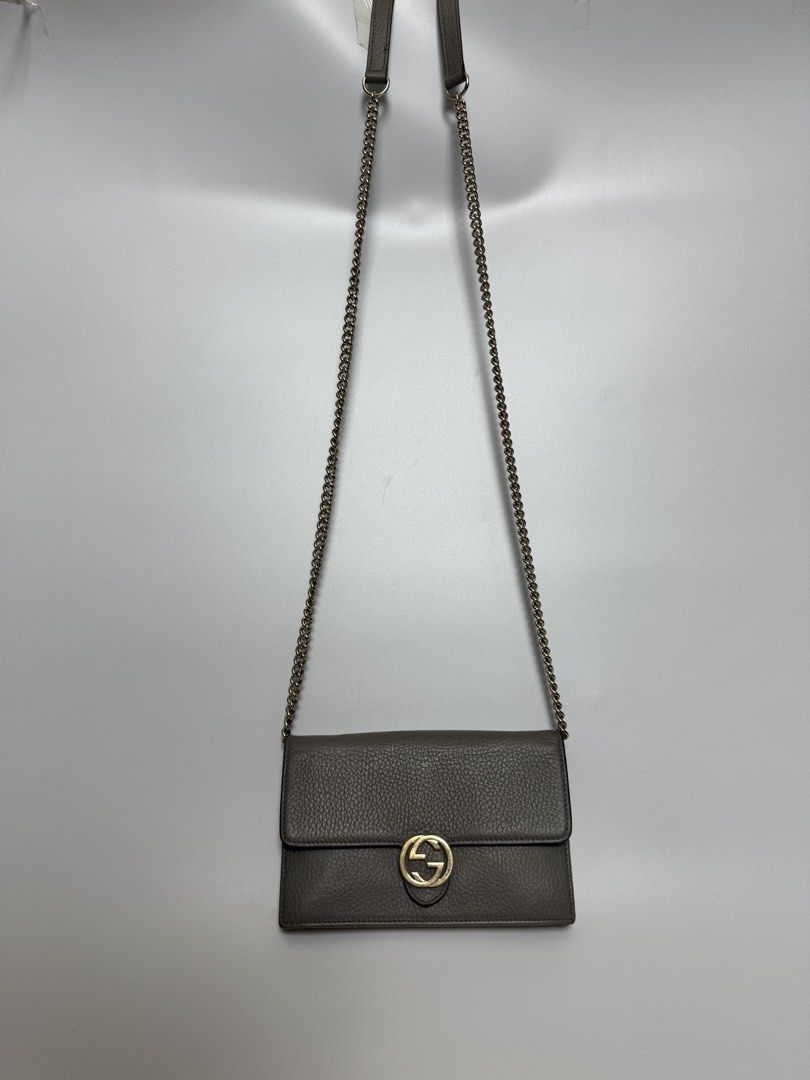 Authentic Gucci Chain Wallet (Category: Luxury Bags & Wallets) located in Cavite. Submitted by loadeadgears (Listing ID 1439345394, Image 3). Description: - Authentic Gucci chain wallet - Grey color - Gold-tone chain strap and hardware - Multiple interior compartments - Includes Entrupy certificate of authenticity - Minor wear on zipper - Textured leather exterior.