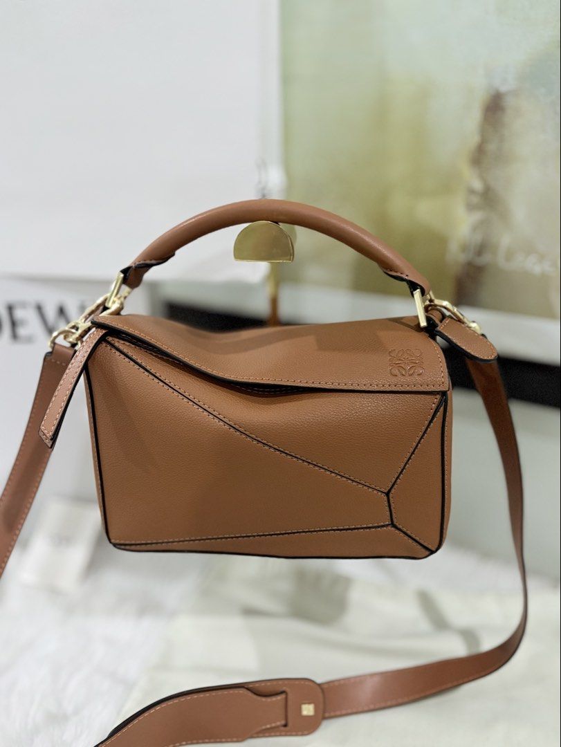 Authentic Loewe puzzle bag in tan ( medium and small ) (Category: Luxury Bags & Wallets) located in Quezon City. Submitted by herluxe_official (Listing ID 1439263991, Image 3). Description: Loewe Small Puzzle Bag 100% Guaranteed Authentic 💯 Dimensions: approximately 24 cm (width) x 16.5 cm (height) x 10.5 cm (depth), or about 9.4 x 6.5 x 4.1 inches ✈️WE SHIP NATIONWIDE ✅SAME DAY DISPATCH COD CASH ON DELIVERY Also available in medium size .