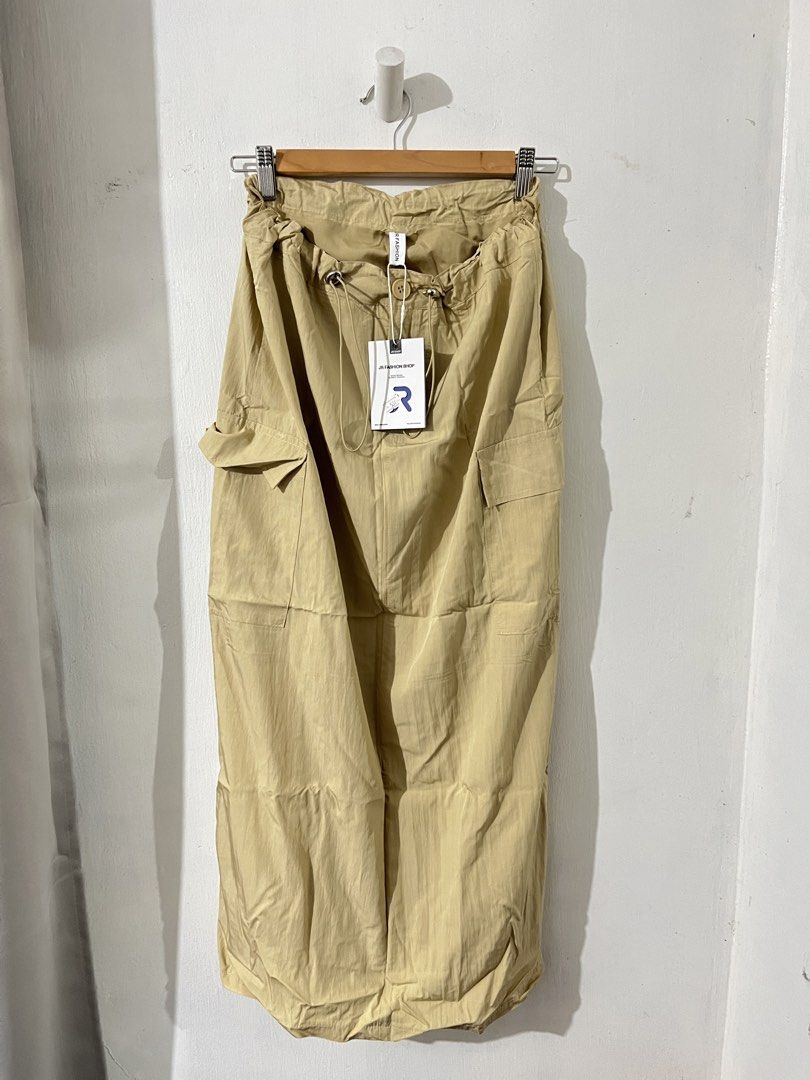 Bangkok Beige Cargo Skirt (Category: Skirts) located in Quezon City. Submitted by g.ysabel (Listing ID 1439295955, Image 3). Description: - Drawstring waist - Two front pockets and two side pockets - Back slit detail - Lightweight material - Brand new with tag and plastic! Got this from Bangkok - Price is still negotiable for sure buyers but please be reasonable 🫶🏻.