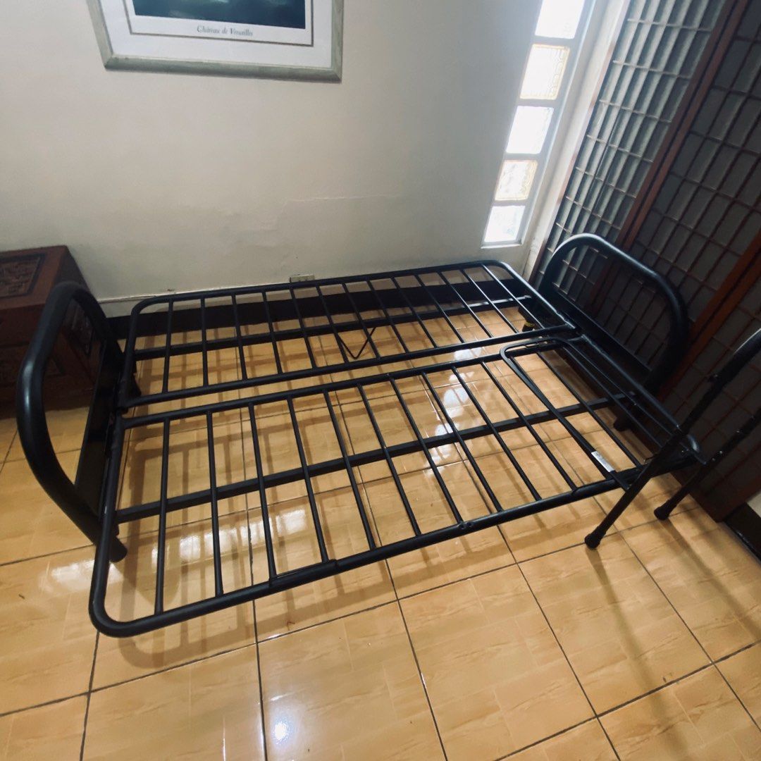 Black Metal Futon Frame (Category: Bed Frames & Mattresses) located in Paranaque City. Submitted by furniture_seller_jay (Listing ID 1439275109, Image 1). Description: - Black metal futon frame - Foldable design (sofa or bed) - Simple, minimalist style - Fits standard futon mattress.