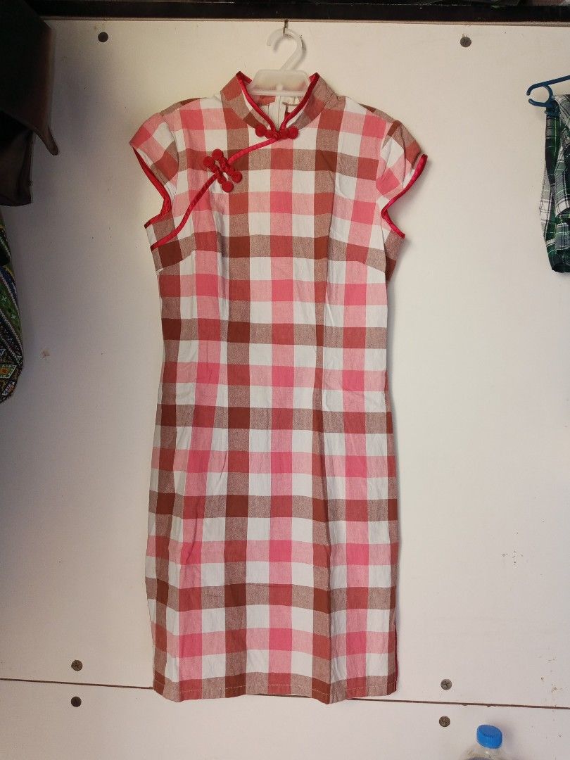 Checkered Cheongsam Dress (Category: Dresses) located in Manila. Submitted by welloved.325 (Listing ID 1439261991, Image 1). Description: - Classic cheongsam design - Mandarin collar and knot buttons - Short sleeves - Straight fit - Checkered fabric in pink, white, and brown - Stylish and unique design - Perfect for various occasions.