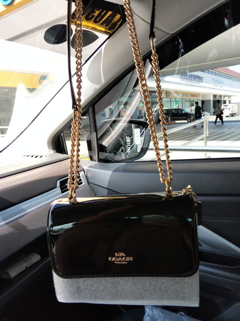 Coach Klare Mini Black Patent Leather (Category: Luxury Bags & Wallets) located in Caloocan City. Submitted by new.pheromagic (Listing ID 1439256576, Image 2). Description: Used once only In pristine condition, super like new SJDM, Bulacan Grab/Lalamove/J&t - Coach shoulder bag - Black patent leather - Gold chain strap - Gold Coach logo - Rectangular shape with flap closure - Compact size.