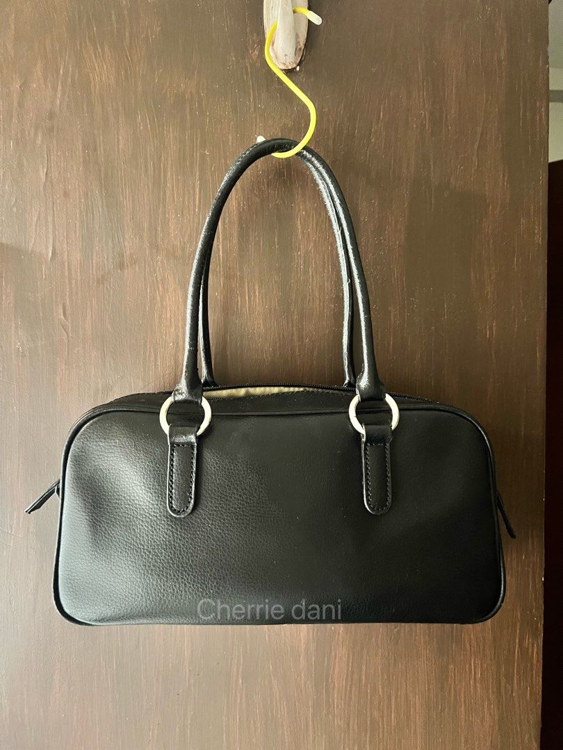 Coquette deer pattern fur shoulder baguette bag (Category: Luxury Bags & Wallets) located in Manila. Submitted by cherrie_dani (Listing ID 1439283622, Image 3). Description: - P. FAME handbag with unique animal print. - Black leather handles and trim. - Silver-tone hardware. - Interior lined with light-colored fabric. - Includes a small pocket. - Rectangular shape with zip closure. - Protective metal feet at the bottom..