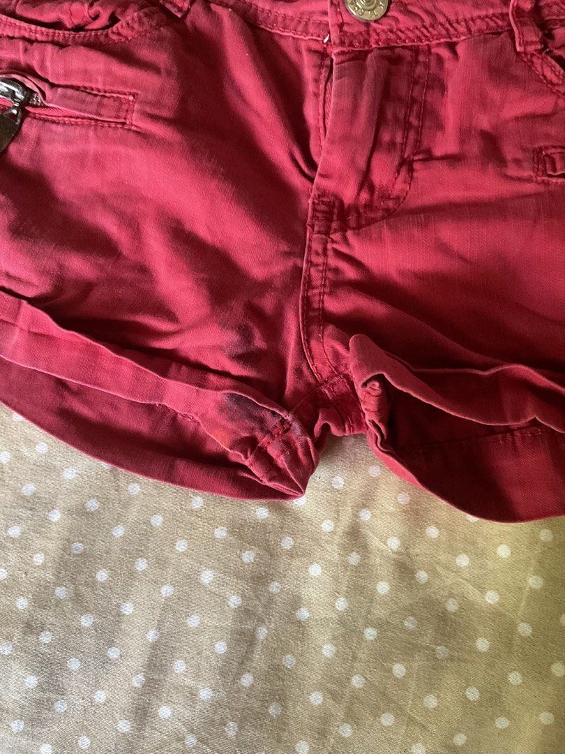 Cute red low waisted shorts y2k (Category: Shorts) located in Manila. Submitted by pookstyle (Listing ID 1439377743, Image 3). Description: Minor stains as listed in the picture. Waist - 28in Length - 9in.