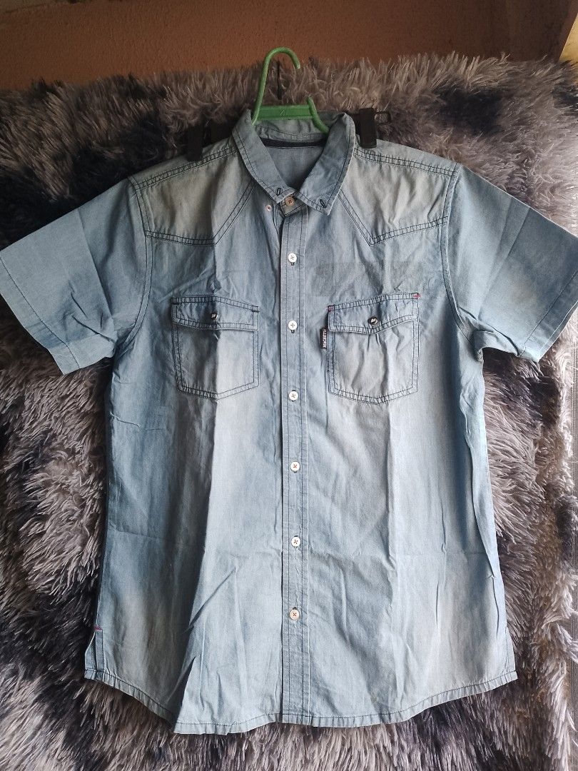 Denim Short Sleeve Shirt (Category: Shirts) located in Manila. Submitted by kimdhyun1 (Listing ID 1439252262, Image 1). Description: - Light blue denim short sleeve shirt - Two chest pockets - Button-down front - Slightly faded denim.