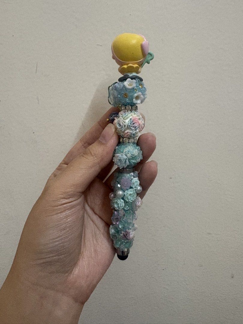 Doorable Bo Peep Pen Customized Decorative Pen (Category: Stationery & School Supplies) located in Manila. Submitted by alyannaros79007 (Listing ID 1439340665, Image 2). Description: - Unique, handcrafted pen - Decorative design with beads, flowers, and a toy topper - Turquoise and white color scheme - Ballpoint pen - Great for gifts or adding personality to your writing.