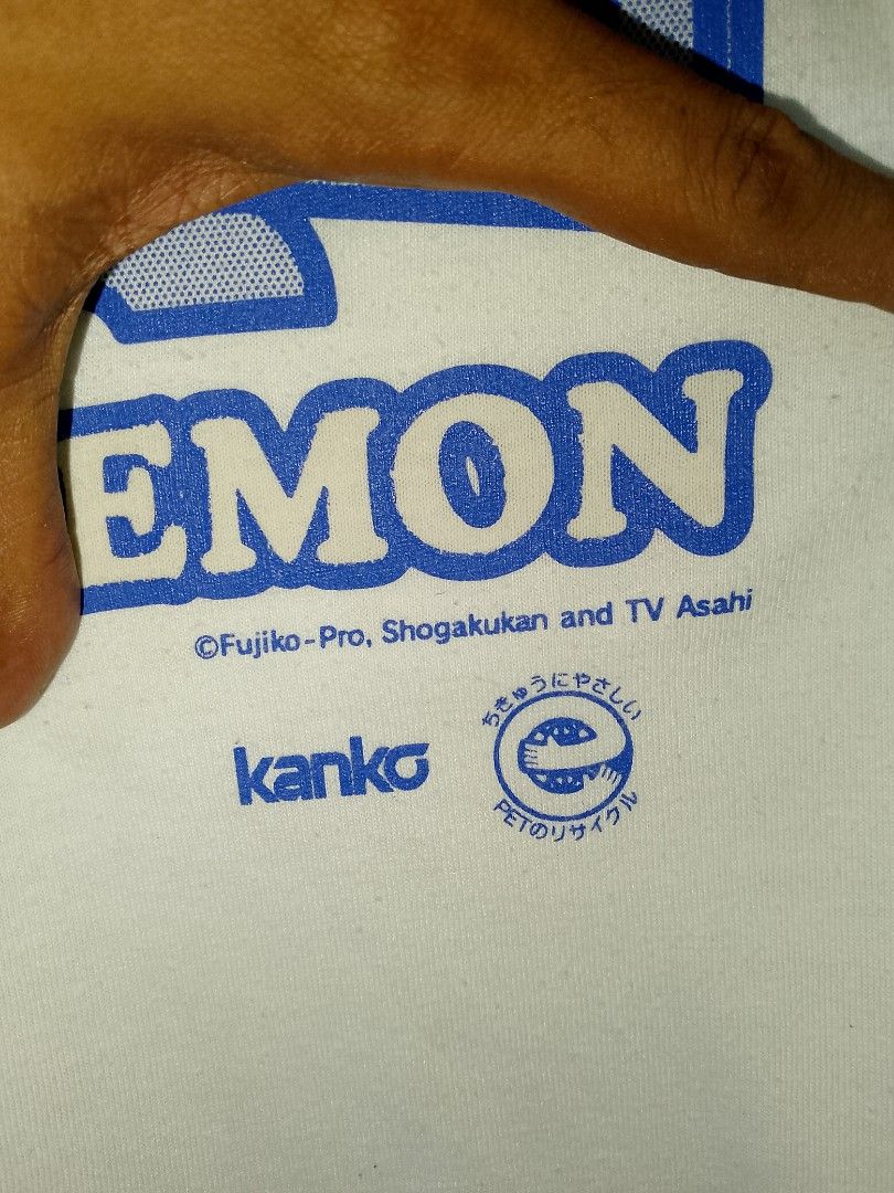 Doraemon Kanko Eco School T-shirt (Category: Tshirts & Polo Shirts ) located in Manila. Submitted by onewikstraight (Listing ID 1439274283, Image 3). Description: - Brand: Kanko Eco School - Design: Doraemon graphic vintage - Singlestich all the way - Size med to large - Color: White - Neckline: Round neck - Condition: Has a small stain on the front. PM Cavite location 1500+sf.