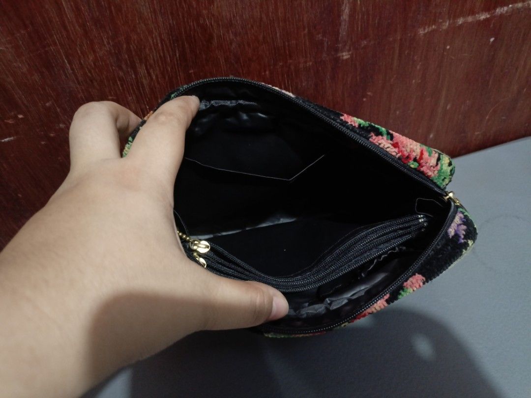 Feiler Floral Cosmetic Bag (Category: Purses & Pouches) located in San Jose del Monte. Submitted by m_nshop (Listing ID 1439349510, Image 3). Description: - Brand: Feiler - Design: Floral pattern on black background - Closure: Zippered with gold-toned pull - Interior: Small zippered pocket - Size: Approximately 8 inches (length) x 6 inches (height) PRELOVED NEEDS CLEANING AND WASHING FROM JAPAN AUCTION NO COD PAYMENT FIRST LALAMOVE OR JNT COURIER