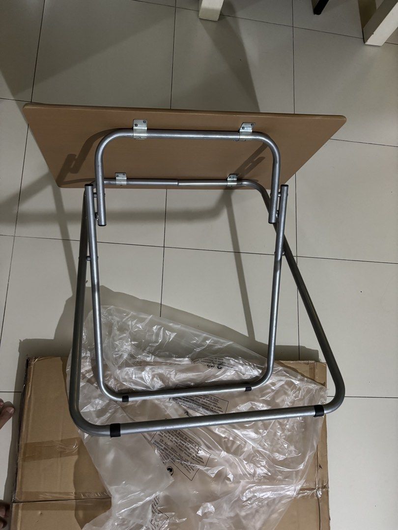 Foldable Study Table - Brand New (Category: Tables & Sets) located in Singapore. Submitted by ovatech (Listing ID 1439360545, Image 3). Description: - Like new foldable study table - Perfect for small spaces - Easy to fold and store - Light brown tabletop - Comes with original packaging.