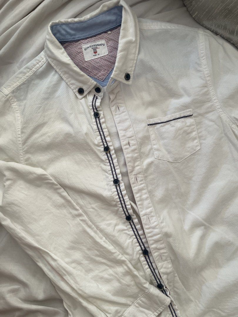 Gingersnaps Boys Shirt Size 12 (Category: Babies & Kids Fashion) located in Cainta. Submitted by anne_garagesale (Listing ID 1439421066, Image 2). Description: Bagay ito sa recognition o moving up day ng inyong anak na lalaki. - Gingersnaps boys' shirt - Size 12 - White base color - Navy blue stitching details - Contrasting pattern on collar and cuffs - Features a chest pocket - Long sleeves - Button closures.