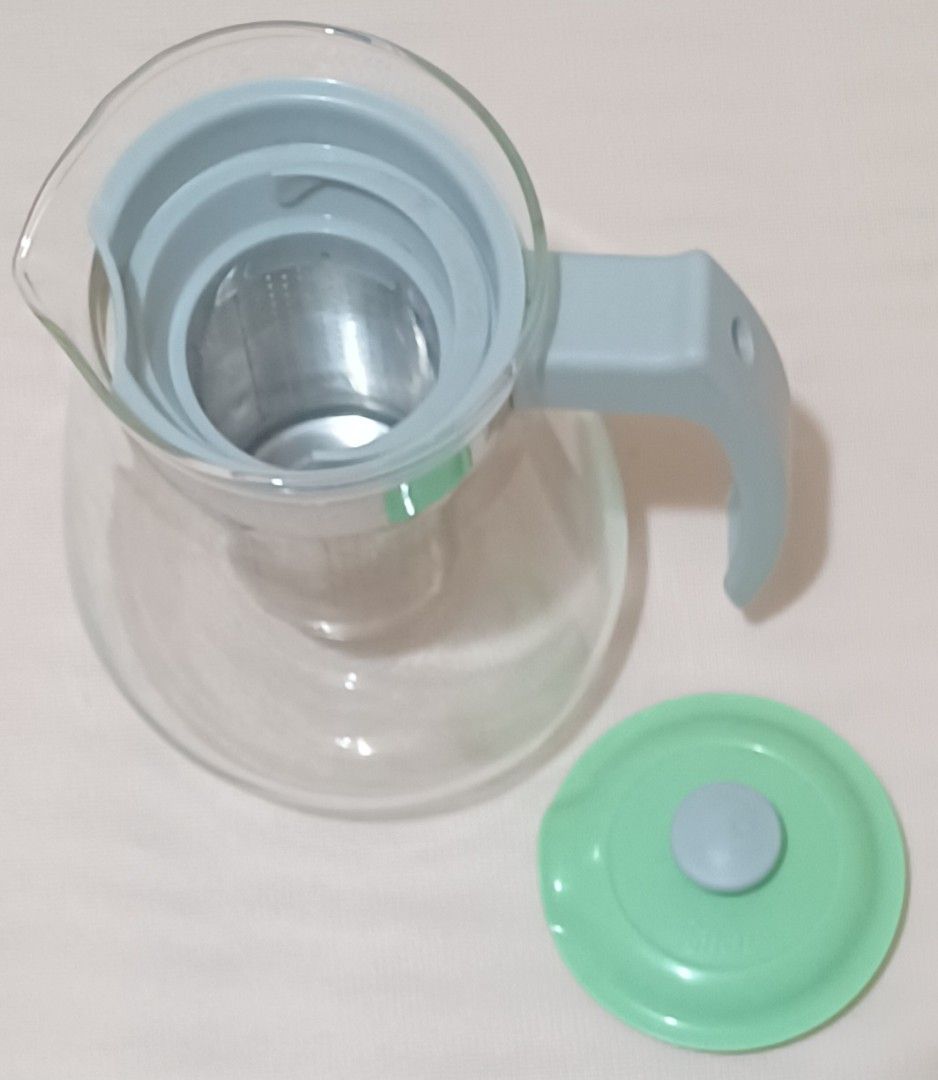 Glass Teapot with Infuser (Category: Coffee & Tea Tableware) located in Quezon City. Submitted by wjmae (Listing ID 1439270462, Image 3). Description: - Glass teapot with removable stainless steel infuser - Stylish mint green lid and handle - Clear glass body to watch your tea brew - Approximately 6 inches tall - Ideal for loose leaf tea and tea bags.