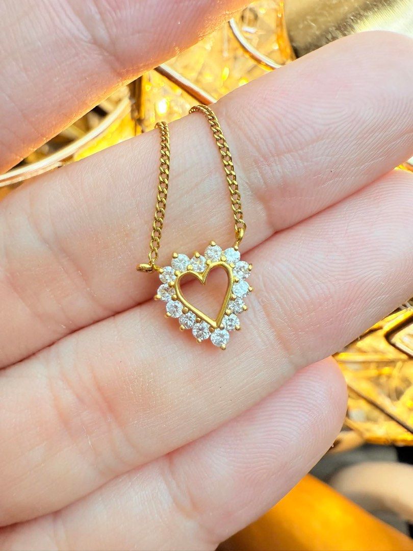 Gold Heart Pendant Necklace (Category: Necklaces) located in San Pedro. Submitted by loveeofgoldiss (Listing ID 1439381753, Image 3). Description: - Gold necklace with heart-shaped pendant - Pendant embellished with clear, sparkling stones - Delicate gold curb chain - Clasp marked "K18".