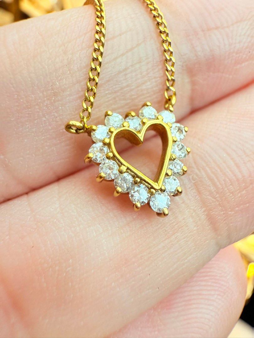 Gold Heart Pendant Necklace (Category: Necklaces) located in San Pedro. Submitted by loveeofgoldiss (Listing ID 1439381753, Image 2). Description: - Gold necklace with heart-shaped pendant - Pendant embellished with clear, sparkling stones - Delicate gold curb chain - Clasp marked "K18".