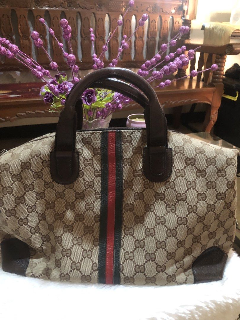 Gucci GG Canvas Handbag (Category: Luxury Bags & Wallets) located in Meycauayan. Submitted by miletteaqu82717 (Listing ID 1439302352, Image 1). Description: - not guaranteed Gucci handbag - Iconic GG canvas - Brown leather handle and trim - Signature red and green stripe - Zip closure - Medium size.