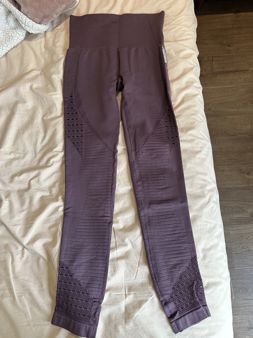 Gymshark Seamless Leggings (Category: Activewear) located in Manila. Submitted by alemanysof97766 (Listing ID 1439313958, Image 1). Description: - Authentic Gymshark seamless leggings - Purple color - High-waisted design - Ribbed detailing - Cut-out patterns on sides and ankles - Gymshark logo visible - Stretchy material - Suitable for workouts and casual wear.
