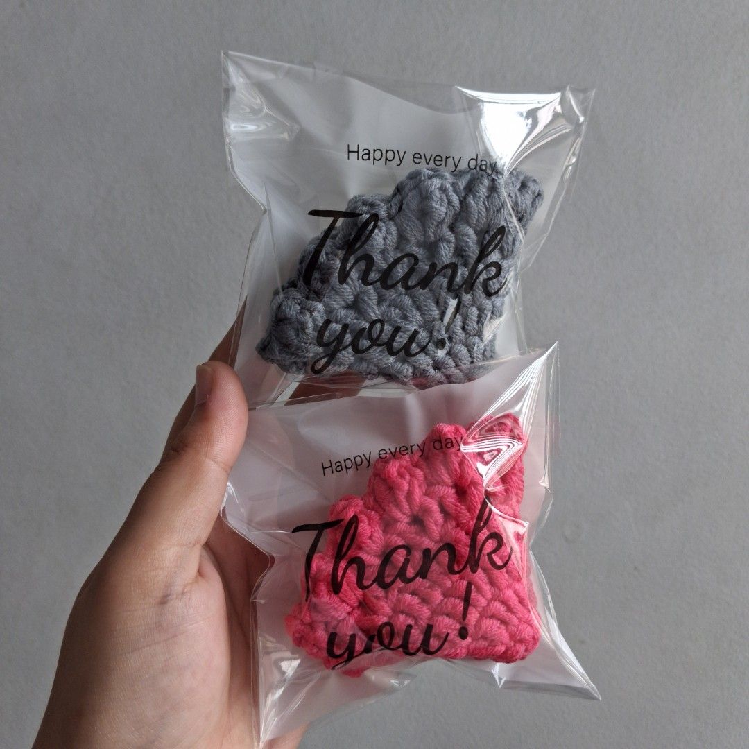 Handmade Crochet Coasters - Set of 2 (Category: Handmade Craft) located in Cebu City. Submitted by starlinggg (Listing ID 1439355745, Image 1). Description: - Set includes two handmade crochet coasters - Colors: Gray and Pink - Shape: Round - Design: Textured - Packaging: Each coaster individually packaged in a clear plastic bag - Includes a 'Thank You' message - Perfect for protecting surfaces - Adds a handmade touch to your home.