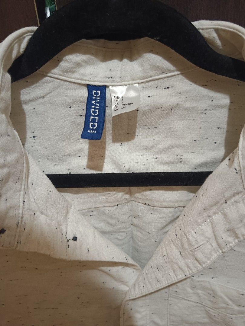 H&M Divided Speckled Button-Down Shirt (Size S) - Off-White (Category: Shirts) located in Manila. Submitted by lovedbydy_ (Listing ID 1439344425, Image 2). Description: Clean & Minimalist aesthetic casual shirt from H&M! ⛱️ Selling this stylish H&M Divided long-sleeve shirt. It’s a beautiful off-white color featuring a unique black speckled/flecked pattern woven into the fabric. Super breathable, looks amazing worn casually with the sleeves rolle