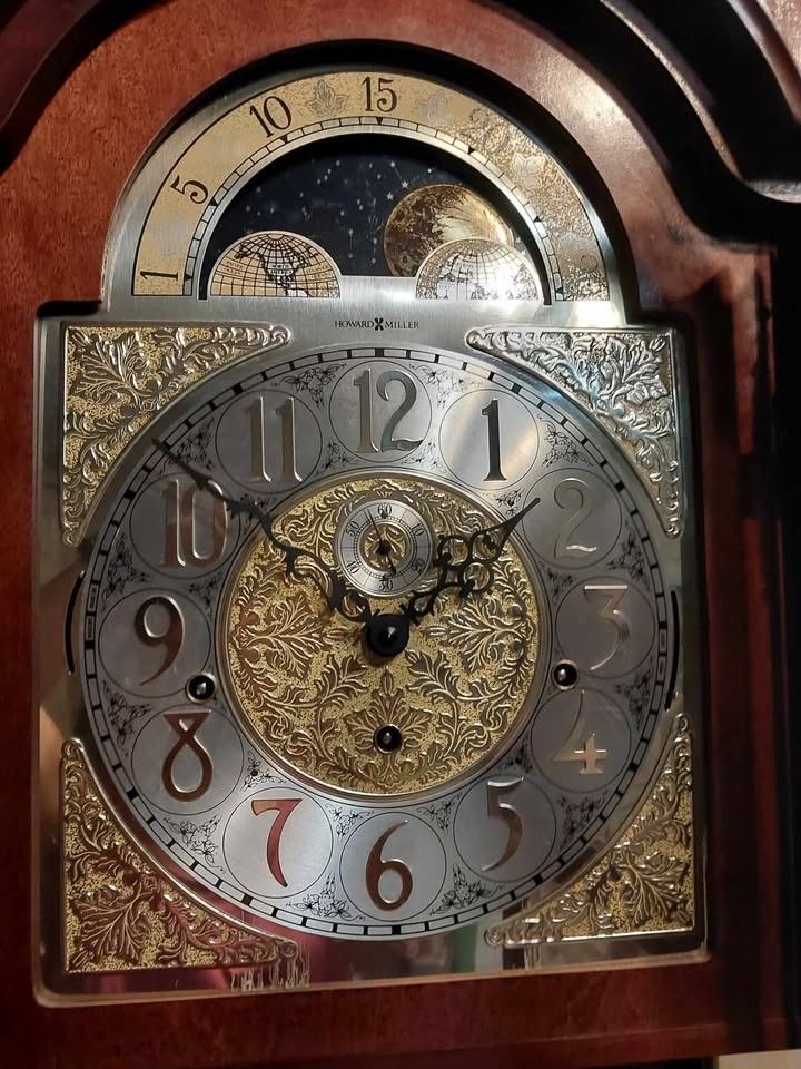 Howard Miller Grandfather Clock (Category: Clocks) located in Manila. Submitted by bryantoyshop (Listing ID 1439257435, Image 2). Description: Size: H.85-1/4 W.22 D.13-1/2 in. With its mechanical movement and wind-up power source, it is a perfect addition to any antique collection. The clock features a wooden frame, glass front, and an oak finish. Original Howard Miller Cabinet is illuminated by an interior light (110V). .