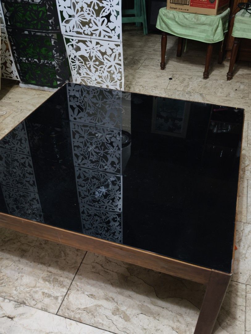 Japanese Table with Black Glass Top (Category: Tables & Sets) located in Quezon City. Submitted by franz14 (Listing ID 1439378266, Image 1). Description: Declutter #3 90x90x35cm - Japanese square table - Modern Design - Black glass top - Sturdy Wooden frame - Suitable for living rooms - Great for drinks, books, or decor (no need coasters) only issue: some part of glass has uneven black color but can be fixed easily! For sale only for 1,700! Napak