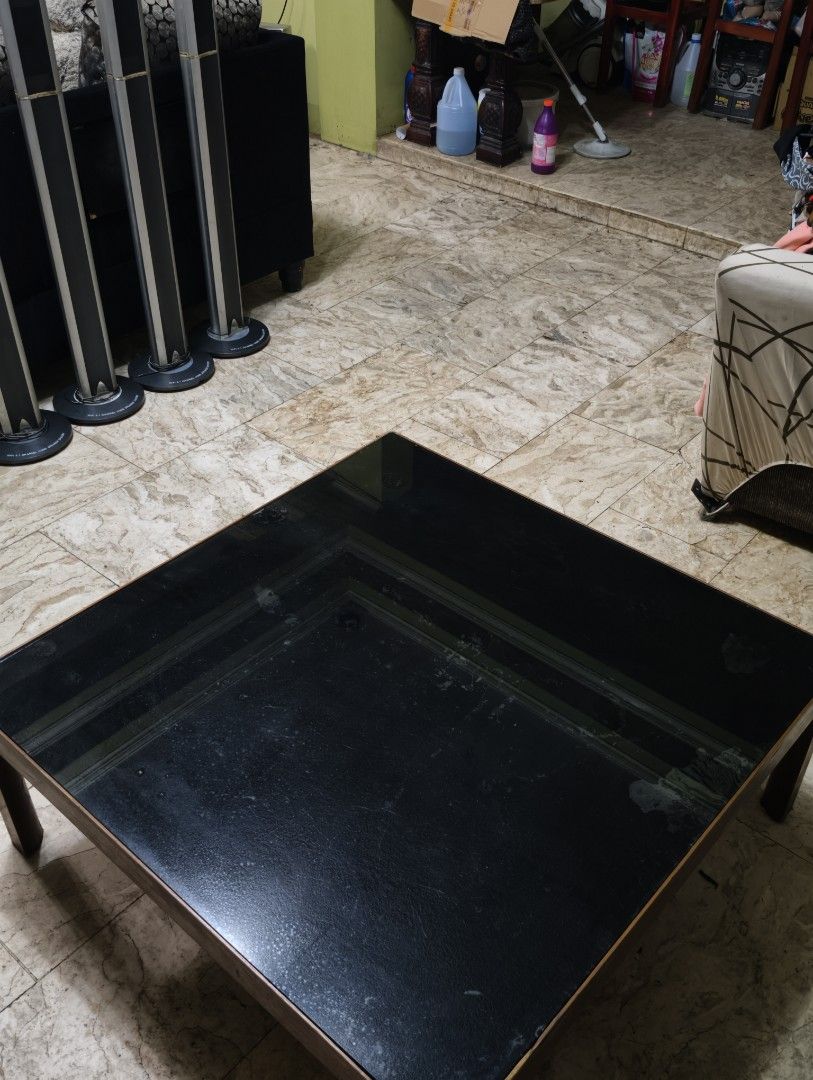 Japanese Table with Black Glass Top (Category: Tables & Sets) located in Quezon City. Submitted by franz14 (Listing ID 1439378266, Image 3). Description: Declutter #3 90x90x35cm - Japanese square table - Modern Design - Black glass top - Sturdy Wooden frame - Suitable for living rooms - Great for drinks, books, or decor (no need coasters) only issue: some part of glass has uneven black color but can be fixed easily! For sale only for 1,700! Napak