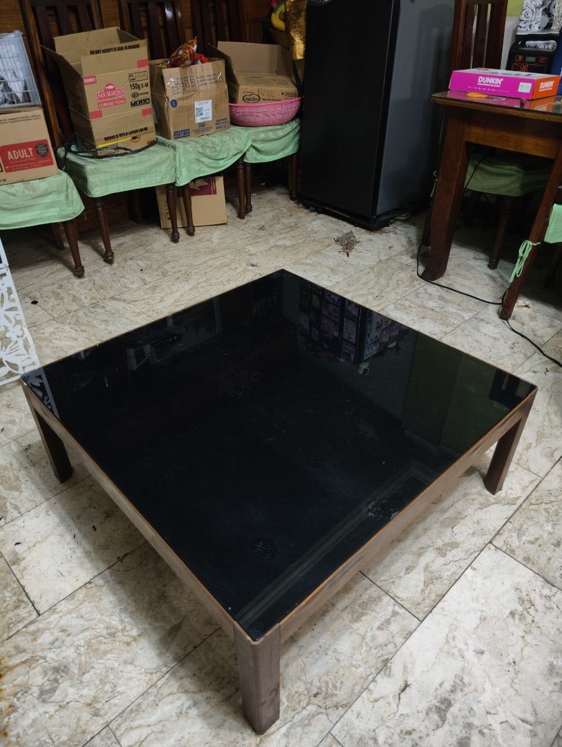Japanese Table with Black Glass Top (Category: Tables & Sets) located in Quezon City. Submitted by franz14 (Listing ID 1439378266, Image 2). Description: Declutter #3 90x90x35cm - Japanese square table - Modern Design - Black glass top - Sturdy Wooden frame - Suitable for living rooms - Great for drinks, books, or decor (no need coasters) only issue: some part of glass has uneven black color but can be fixed easily! For sale only for 1,700! Napak