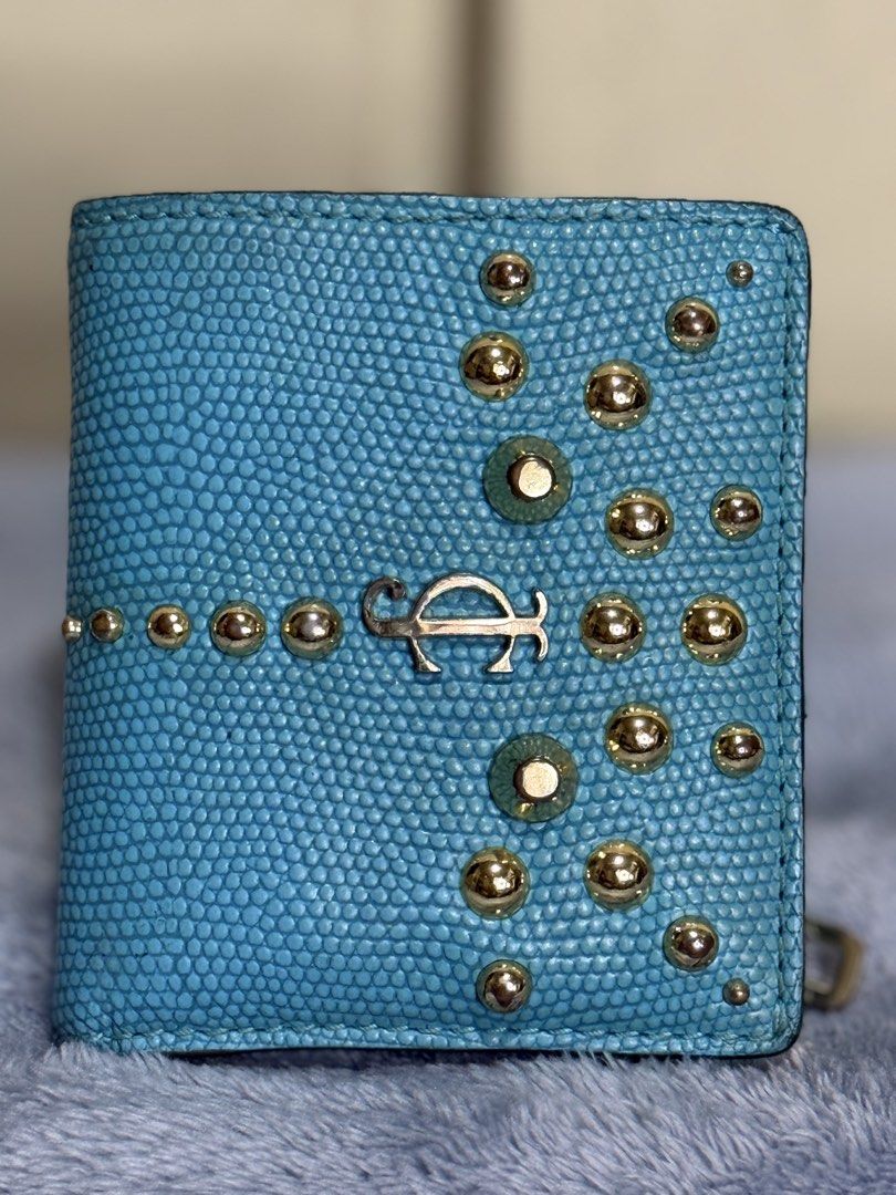 Jui*cy Cou*ture Bifold Leather Wallet (Category: Wallets & Card holders) located in Caloocan City. Submitted by paterf (Listing ID 1439300995, Image 2). Description: • Turquoise genuine goat leather with gold-tone hardwares & accents • Vintage • Made in China • Size: S • Measurements: 3.5” L x .75” W x 4” H • 1 bill slot, 3 card slots, 3 side compartments, a photo slot & 1 coin slot • YKK zip • Good used condition with normal signs of wear & stor