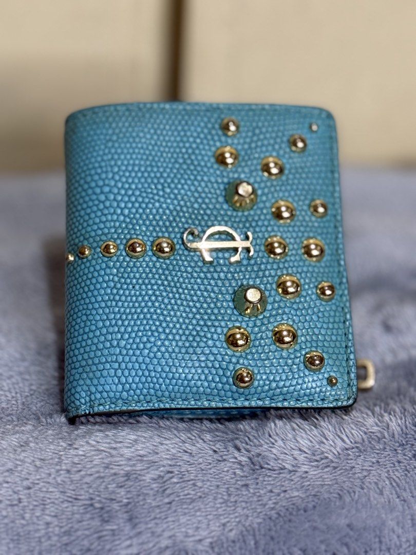 Jui*cy Cou*ture Bifold Leather Wallet (Category: Wallets & Card holders) located in Caloocan City. Submitted by paterf (Listing ID 1439300995, Image 1). Description: • Turquoise genuine goat leather with gold-tone hardwares & accents • Vintage • Made in China • Size: S • Measurements: 3.5” L x .75” W x 4” H • 1 bill slot, 3 card slots, 3 side compartments, a photo slot & 1 coin slot • YKK zip • Good used condition with normal signs of wear & stor