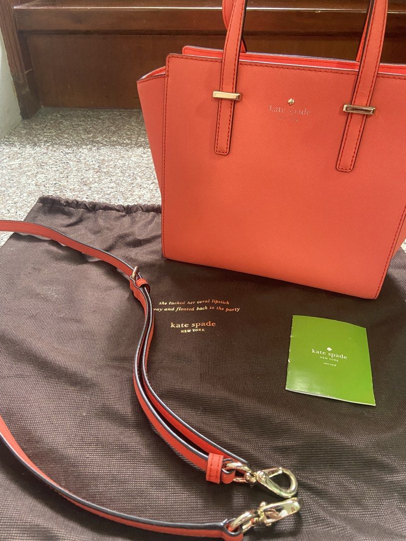 Kate Spade Coral Handbag with Shoulder Strap (Category: Luxury Bags & Wallets) located in San Pablo. Submitted by vernikas (Listing ID 1439272677, Image 1). Description: - Authentic Kate Spade handbag - Coral color - Detachable shoulder strap - Gold-toned hardware - Top zipper closure - Includes dust bag and care card - Interior with patterned lining and small pocket - Structured design - Two top handles.
