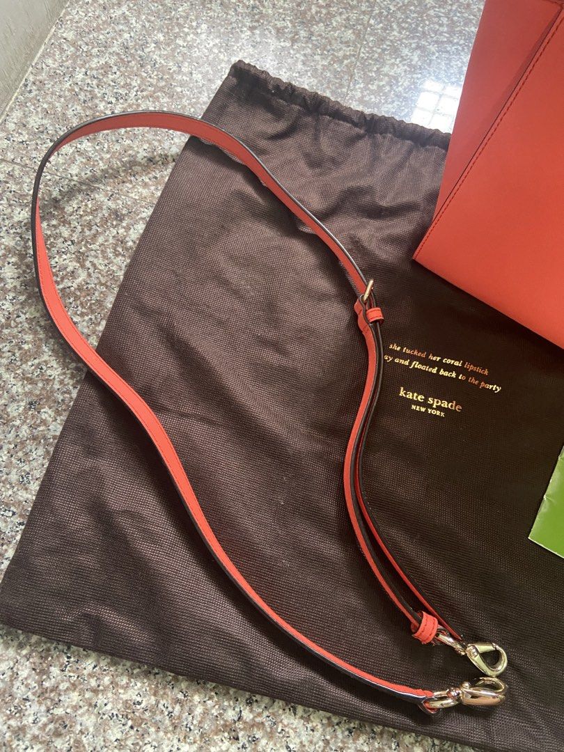 Kate Spade Coral Handbag with Shoulder Strap (Category: Luxury Bags & Wallets) located in San Pablo. Submitted by vernikas (Listing ID 1439272677, Image 2). Description: - Authentic Kate Spade handbag - Coral color - Detachable shoulder strap - Gold-toned hardware - Top zipper closure - Includes dust bag and care card - Interior with patterned lining and small pocket - Structured design - Two top handles.