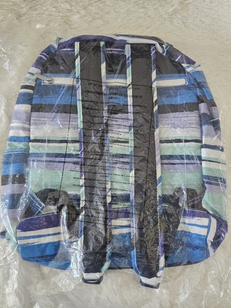 Kipling Backpack with Blue Stripes (Category: Backpacks) located in Taguig. Submitted by ljdm_22 (Listing ID 1439276928, Image 3). Description: - Brand new Kipling backpack - Eye-catching blue striped design - Multiple compartments for storage - Includes front zippered pocket and side pockets - Comes with the iconic Kipling monkey keychain - Adjustable straps for a comfortable fit - Top handle for easy carrying - Still in original packaging - fre
