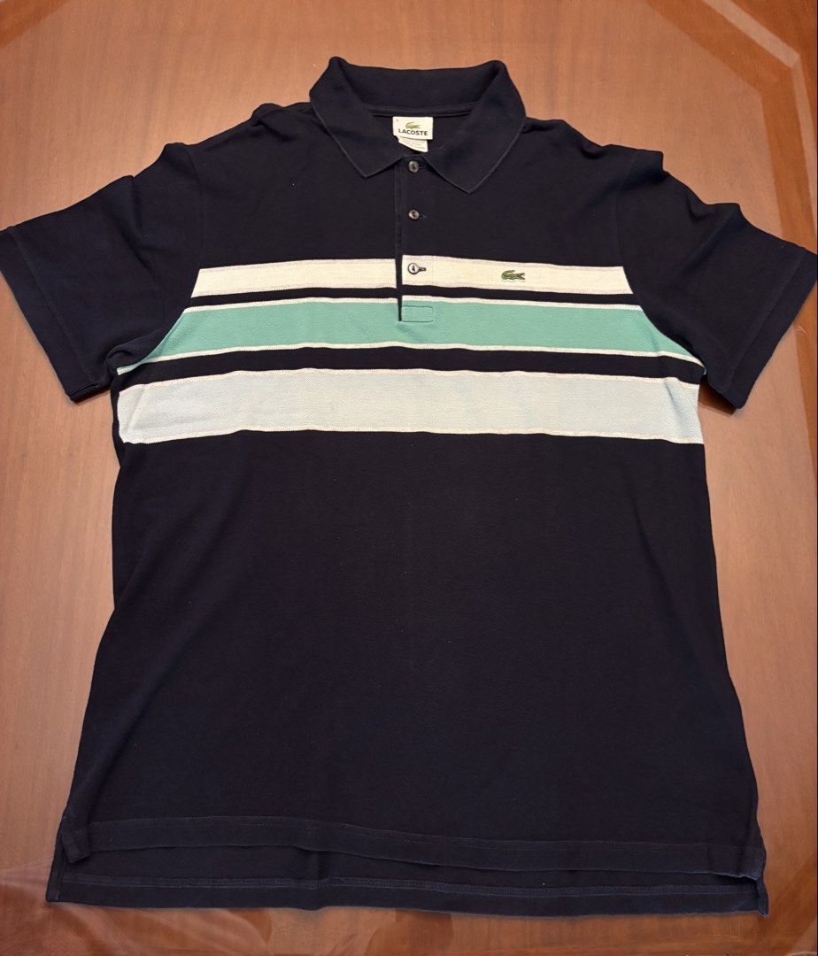 Lacoste Striped Polo Shirt (Category: Tshirts & Polo Shirts ) located in Manila. Submitted by senior.declutter (Listing ID 1439260612, Image 2). Description: - Authentic Lacoste polo shirt - Striped design (navy blue, white, mint green) - Size 6 - Made in Peru - 100% cotton - Features the Lacoste crocodile logo - Dimensions: chest circumference 42” shoulder 19” length 29” RFS: decluttering .