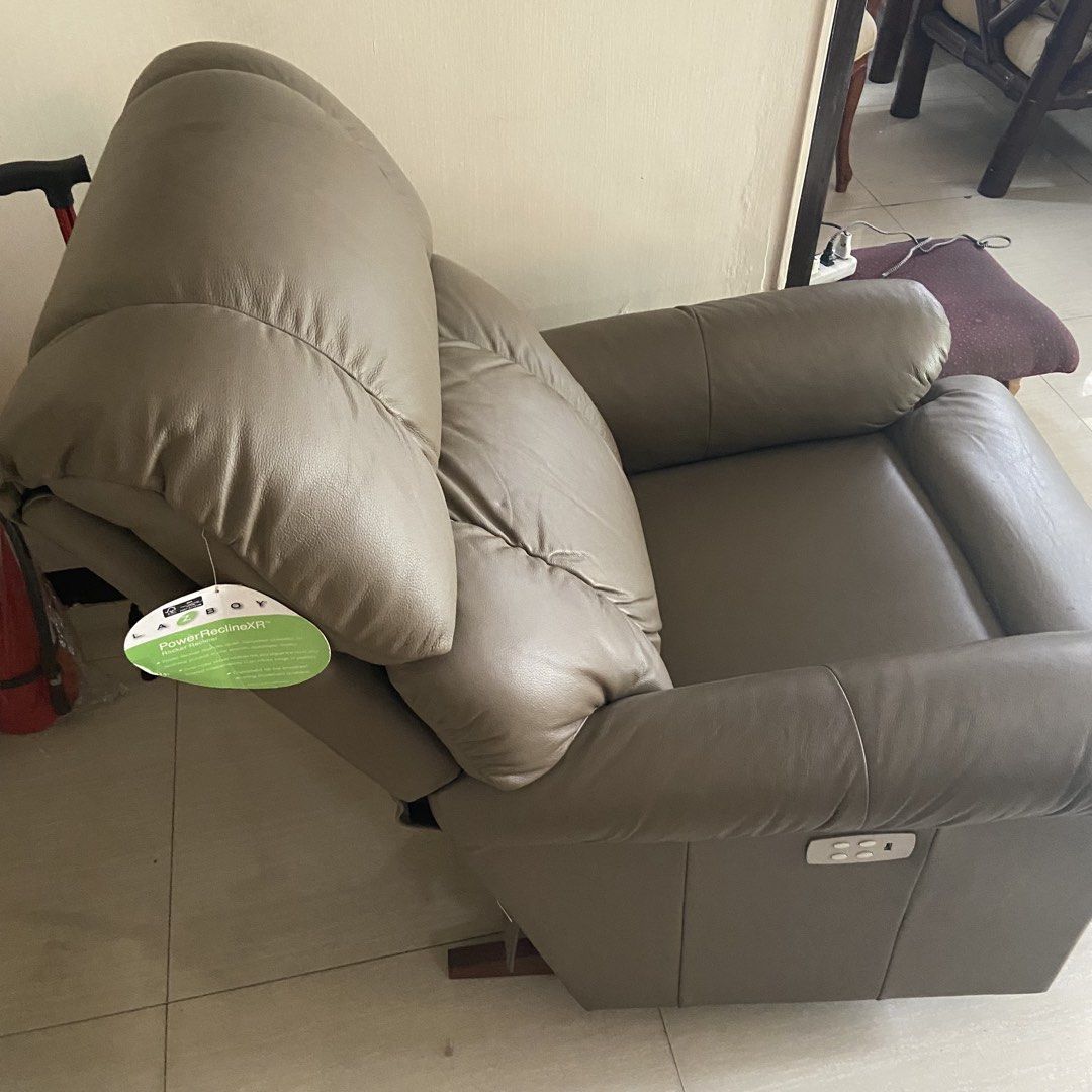 La-Z-Boy Power Recliner (Category: Chairs) located in Paranaque City. Submitted by furniture_seller_jay (Listing ID 1439267422, Image 3). Description: - La-Z-Boy Power Recliner - Light brown color - Power reclining feature - Padded headrest and armrests - Comfortable design No issues, very lightly used. P70k firm. Need space. .