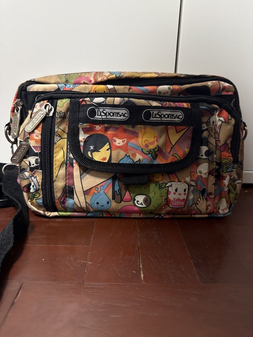 LeSportsac Crossbody Bag (Category: Cross-body Bags) located in Manila. Submitted by matet_s (Listing ID 1439388204, Image 2). Description: - LeSportsac crossbody bag - Colorful print - Multiple compartments - Adjustable black strap - LeSportsac logo on front.