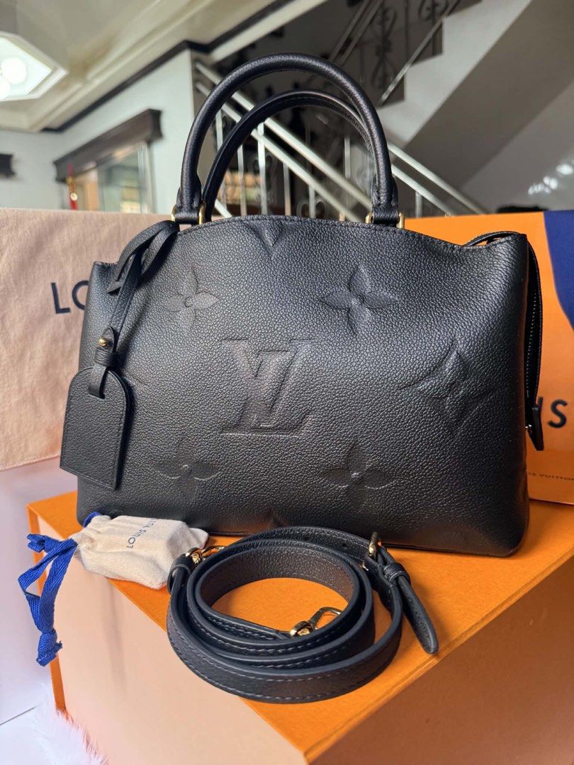 Louis Vuitton Coussin PM Black (Category: Luxury Bags & Wallets) located in Malabon City. Submitted by cosmicwhale_4f8f76 (Listing ID 1439274259, Image 1). Description: - Authentic Louis Vuitton Coussin PM handbag - Color: Black - Features a top handle and detachable shoulder strap - Secure zip closure - Interior: Red - Includes: Dust bag, small pouch, and box - Exterior: Iconic Louis Vuitton embossed pattern. Louis Vuitton Petit Palais PM (M5891