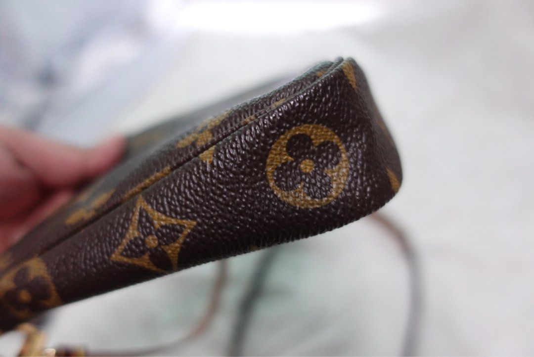 Louis Vuitton Monogram Pochette (Category: Luxury Bags & Wallets) located in Santa Rosa. Submitted by iam.mvc_ (Listing ID 1439304063, Image 2). Description: - Authentic Louis Vuitton Monogram Pouch - Features the iconic LV monogram pattern - Comes with a convenient wrist strap - Gold-tone zipper closure - Made in France.
