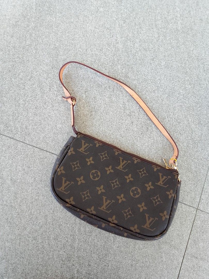 Louis Vuitton Pochette Accessories (Category: Luxury Bags & Wallets) located in Iloilo. Submitted by janillthrifted (Listing ID 1439387104, Image 1). Description: - Authentic Louis Vuitton Pochette Accessories handbag - Iconic LV monogram pattern - Detachable strap included - Gold-tone zipper - Interior leather tag with Louis Vuitton logo and "Made in France" inscription.