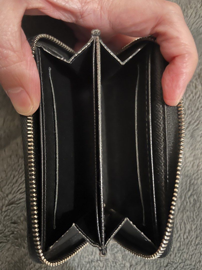 Louis Vuitton Zippy Coin Purse (Category: Luxury Bags & Wallets) located in Manila. Submitted by encoreluxeph (Listing ID 1439342050, Image 2). Description: - Authentic Louis Vuitton Zippy Coin Purse - Features Damier Graphite canvas exterior - Multiple compartments for cards and coins - Includes original dust bag - Made in France.