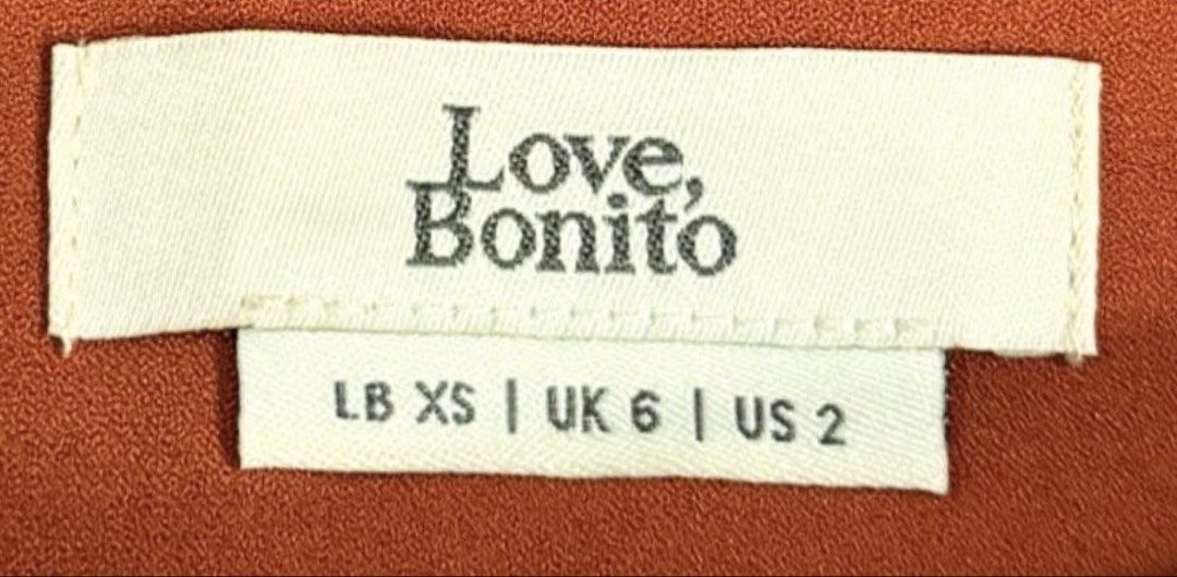 Love, Bonito Rust Wide-Leg Trousers (Category: Other Bottoms) located in Davao. Submitted by my_picks (Listing ID 1439403435, Image 2). Description: Never used, only tried on. Tags already discarded. Super classy and flattering fit with high waist and wide-leg cut — perfect for office wear, brunch dates, or smart casual looks. Details: • Brand: Love, Bonito • Size: XS / UK 6 / US 2 • Fits waist 25–26 • Color: Rust / burnt orange • Never used • So