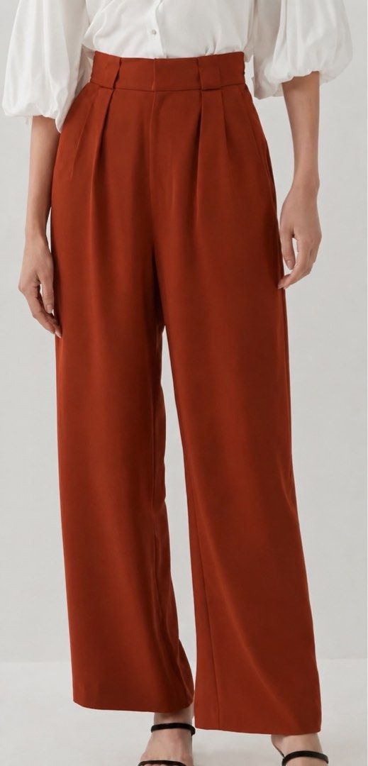 Love, Bonito Rust Wide-Leg Trousers (Category: Other Bottoms) located in Davao. Submitted by my_picks (Listing ID 1439403435, Image 1). Description: Never used, only tried on. Tags already discarded. Super classy and flattering fit with high waist and wide-leg cut — perfect for office wear, brunch dates, or smart casual looks. Details: • Brand: Love, Bonito • Size: XS / UK 6 / US 2 • Fits waist 25–26 • Color: Rust / burnt orange • Never used • So