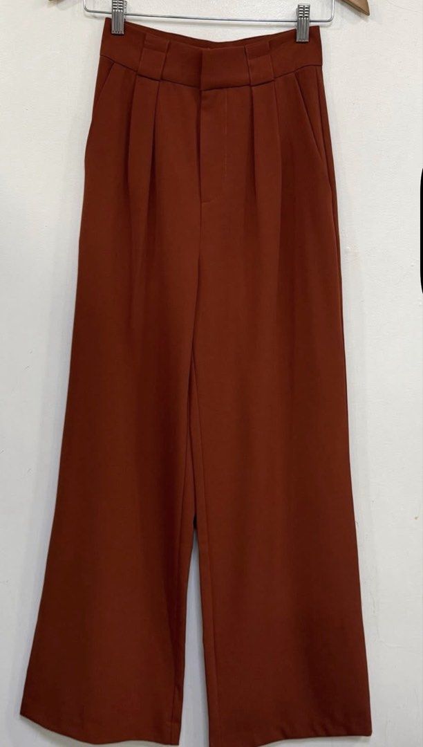 Love, Bonito Rust Wide-Leg Trousers (Category: Other Bottoms) located in Davao. Submitted by my_picks (Listing ID 1439403435, Image 3). Description: Never used, only tried on. Tags already discarded. Super classy and flattering fit with high waist and wide-leg cut — perfect for office wear, brunch dates, or smart casual looks. Details: • Brand: Love, Bonito • Size: XS / UK 6 / US 2 • Fits waist 25–26 • Color: Rust / burnt orange • Never used • So