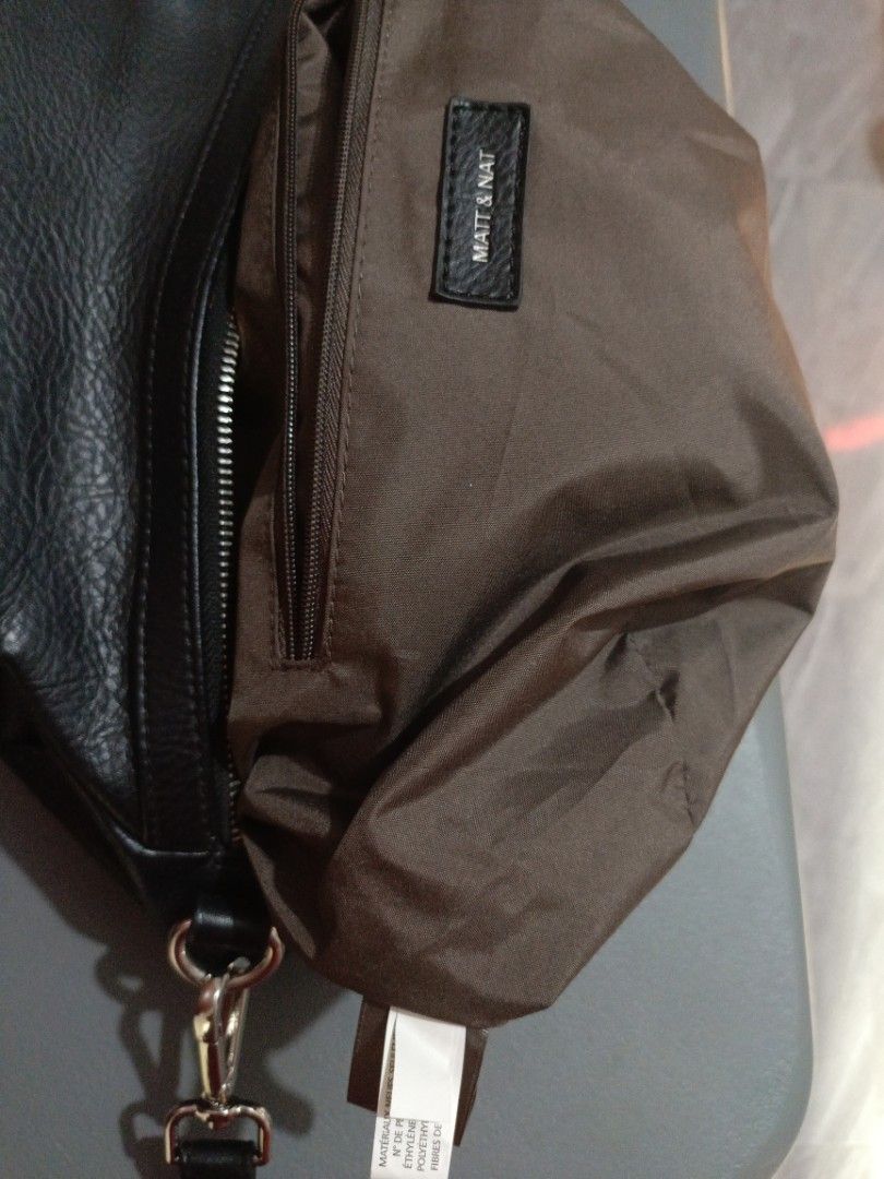Matt & Nat Two Way bag (Category: Luxury Bags & Wallets) located in San Jose del Monte. Submitted by m_nshop (Listing ID 1439335988, Image 2). Description: - Matt & Nat black handbag - Top handle and detachable shoulder strap - Interior made from recycled plastic bottles - Zippered main compartment - Additional interior pocket - Silver-toned hardware - Textured exterior material PRELOVED FROM JAPAN AUCTION NO COD PAYMENT FIRST LALAMOVE OR JNT COU