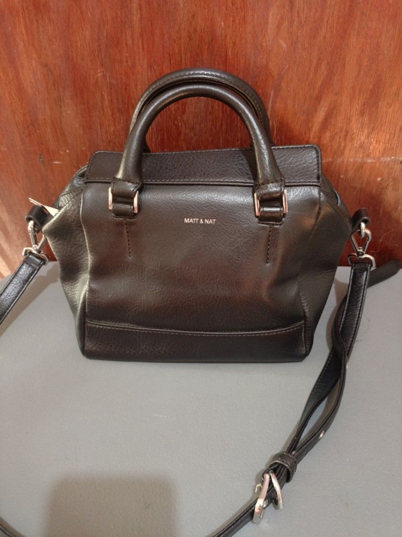 Matt & Nat Two Way bag (Category: Luxury Bags & Wallets) located in San Jose del Monte. Submitted by m_nshop (Listing ID 1439335988, Image 1). Description: - Matt & Nat black handbag - Top handle and detachable shoulder strap - Interior made from recycled plastic bottles - Zippered main compartment - Additional interior pocket - Silver-toned hardware - Textured exterior material PRELOVED FROM JAPAN AUCTION NO COD PAYMENT FIRST LALAMOVE OR JNT COU